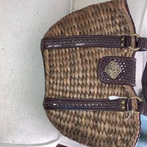 Nice straw woven cold water creek bag, with beautiful detail on leather/bindings